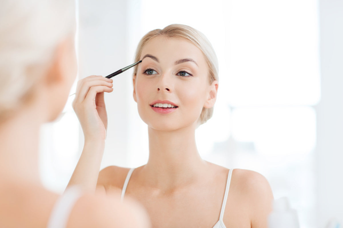 Woman applying her no-makeup makeup