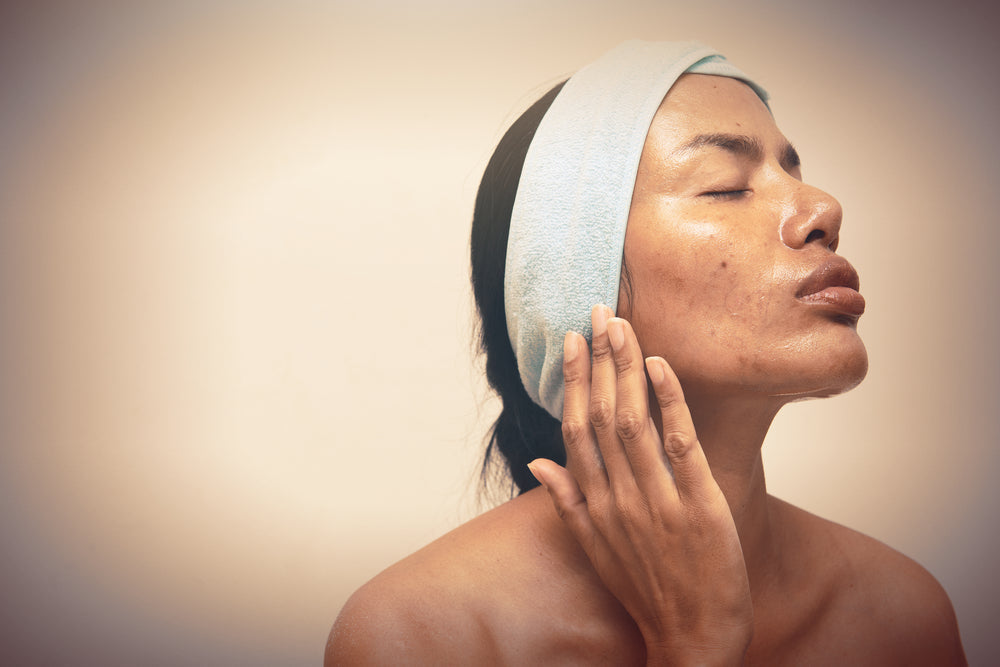 Latina woman with oily skin.