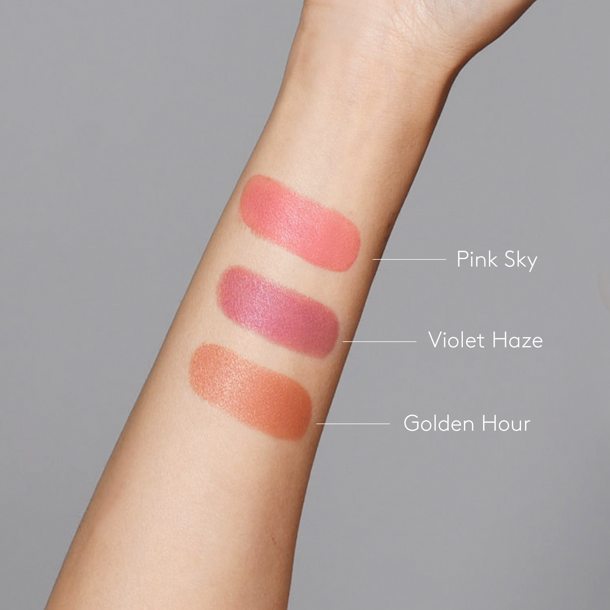Sunforgettable® Total Protection™ Color Balm SPF 50 Pink Sky, Violet Haze, and Golden Hour swatches on fair skintone arm || all