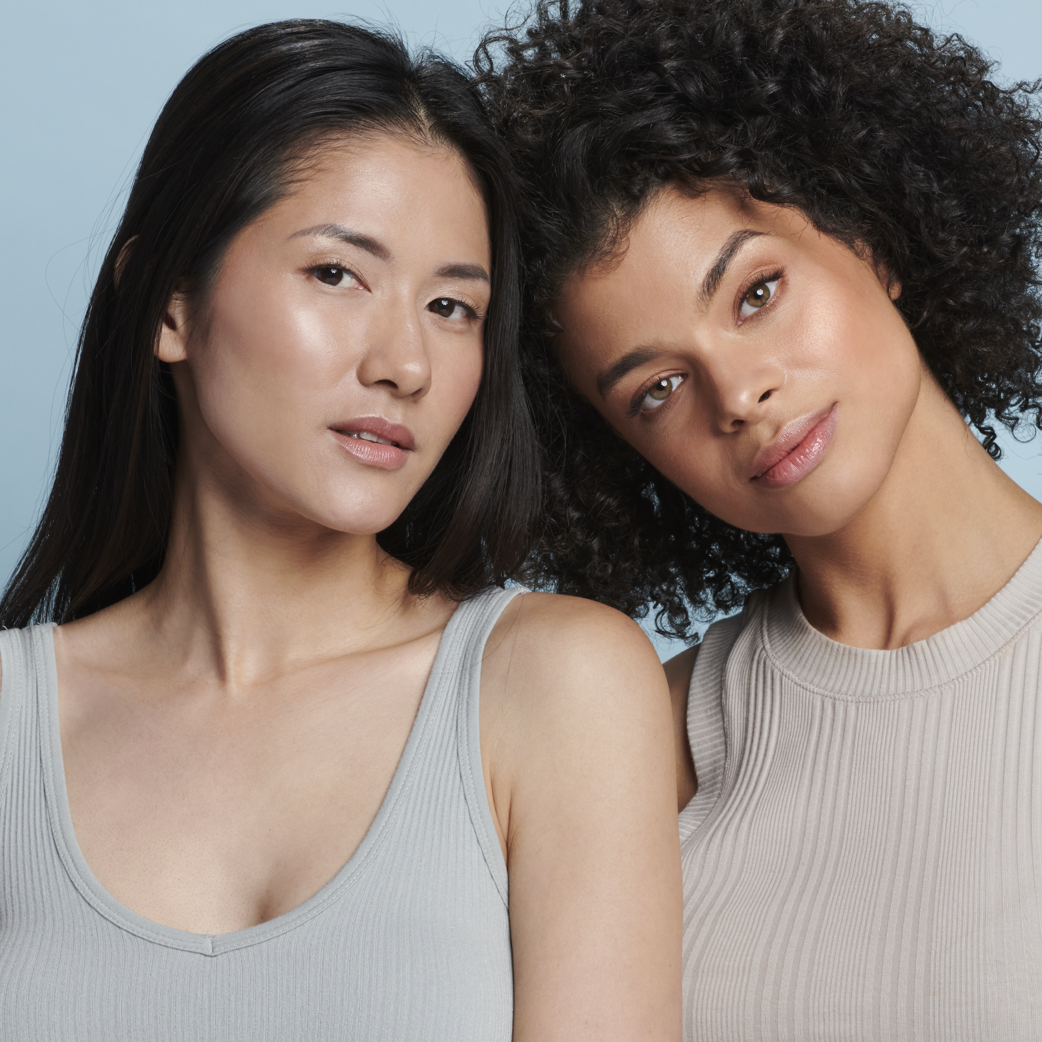 Models wearing Sunforgettable® Total Protection™ Brush-On Shield Glow SPF 50 || all