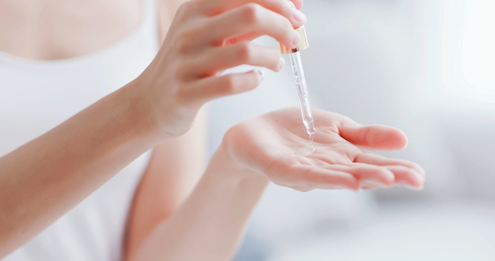 Hands using peptide serum applicator