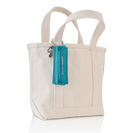 Brush holder attached to canvas tote