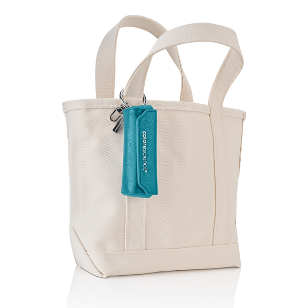 Brush holder attached to canvas tote