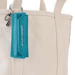 Brush holder attached to canvas tote