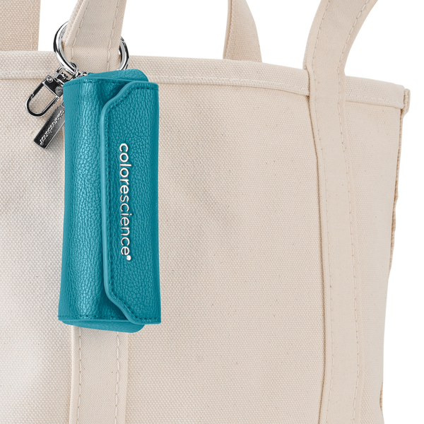 Brush holder attached to canvas tote