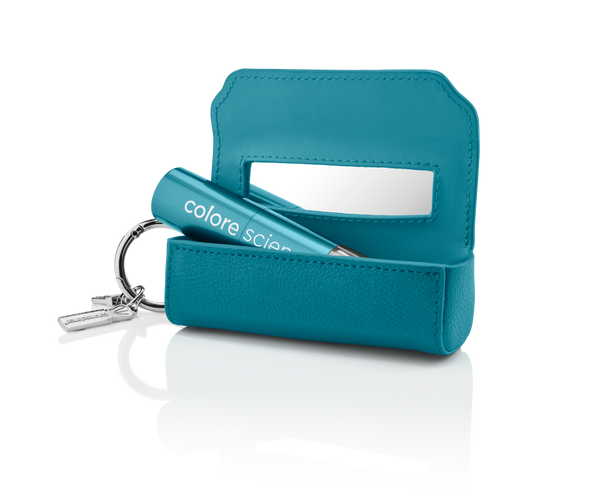Brush holder open with sunscreen brush inside