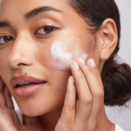woman washing face using Barrier Pro™ 1-Step Cleanser