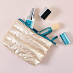 Protect & Glow Essentials Holiday Kit, featuring a limited-edition travel mini Colorescience® Barrier Pro™ Essential Moisturizer & Best-selling Total Protection® Brush-On Shield SPF 50 Glow with patented EnviroScreen® 5-Point Protection.  Includes a FREE puffy pouch.