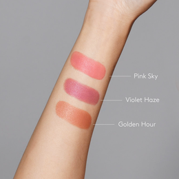 Sunforgettable® Total Protection™ Color Balm SPF 50 Pink Sky, Violet Haze, and Golden Hour swatches on fair skintone arm