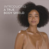 Video of model applying body shield glow mineral sunscreen || all