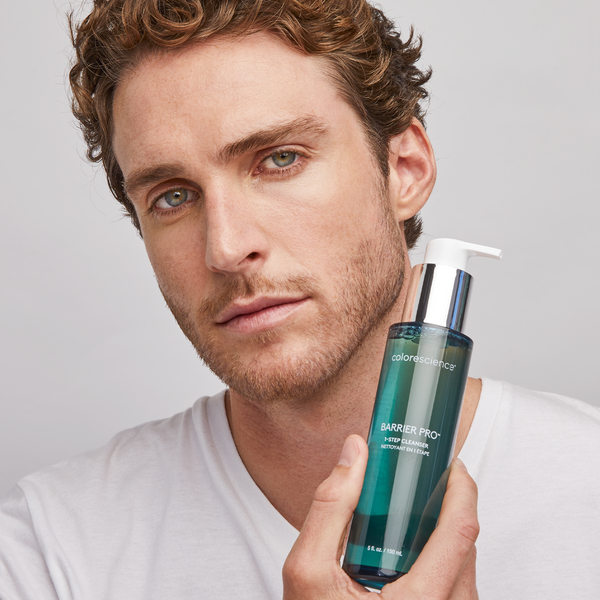 man holding Barrier Pro™ 1-Step Cleanser