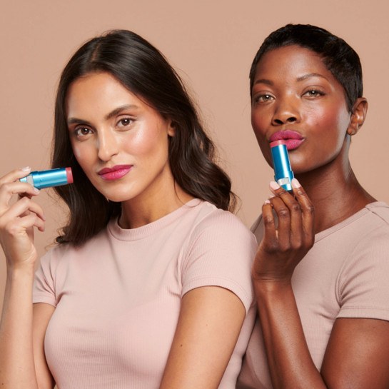 Models wearing the Berry shade of Sunforgettable® Total Protection™ Color Balms SPF 50 || Berry