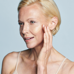 Model with swatch of Even Up® Clinical Pigment Perfector® SPF 50