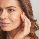 Model applying Total Protection™ No Show™ Mineral Sunscreen SPF 50
