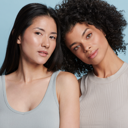 Two women, one with fair and one with deep skin tone wearing Sunforgettable® Total Protection™ Face Shield Classic SPF 50